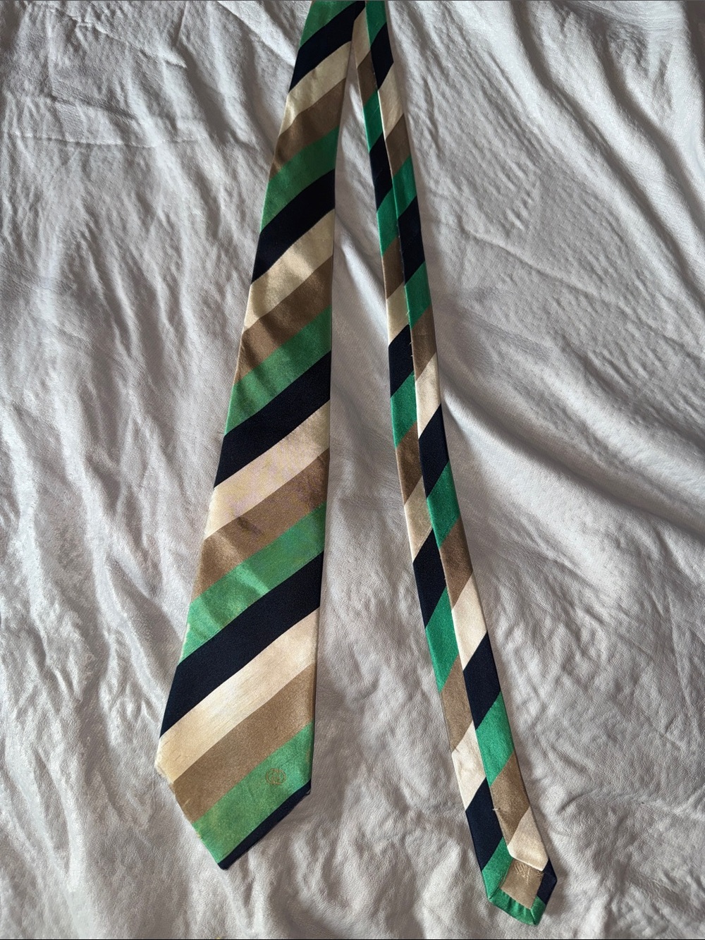 Vintage Gucci tie. Has frayed ends but overall clean and in good condition.